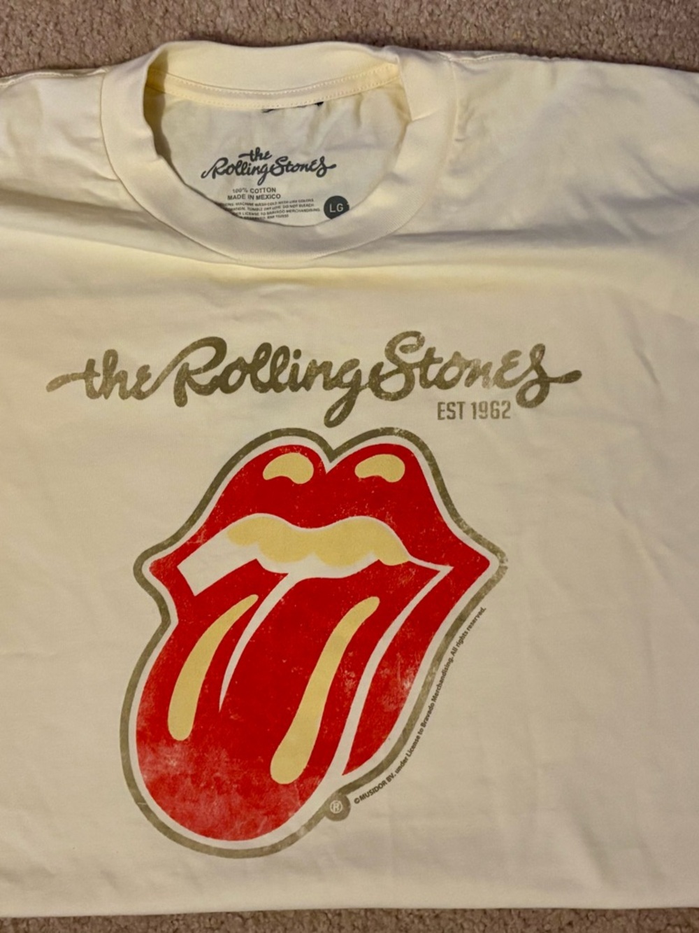 the Rolling Stones Cream Kids Tee with Red Tongue Graphic